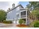Two-story home with screened porch and two-car garage at 5250 Timber Race Crse, Hollywood, SC 29449