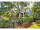 House exterior with fenced backyard and large tree at 5250 Timber Race Crse, Hollywood, SC 29449