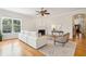 Living room with hardwood floors, fireplace, and view to entryway at 5250 Timber Race Crse, Hollywood, SC 29449