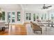 Spacious living room with hardwood floors, fireplace, and access to a deck at 5250 Timber Race Crse, Hollywood, SC 29449