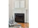 Elegant fireplace with white mantel and a black hearth at 5250 Timber Race Crse, Hollywood, SC 29449
