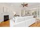 Living area with hardwood floors, sectional sofa and fireplace at 5250 Timber Race Crse, Hollywood, SC 29449
