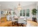 Kitchen dining area with hardwood floors, chandelier, and view to kitchen at 5250 Timber Race Crse, Hollywood, SC 29449