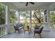 Bright screened porch overlooking tranquil water views, furnished with comfortable seating at 5250 Timber Race Crse, Hollywood, SC 29449