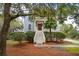 Two-story light blue house with white trim, a front porch, and lush landscaping at 5250 Timber Race Crse, Hollywood, SC 29449