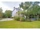 Blue house with backyard and screened porch at 5250 Timber Race Crse, Hollywood, SC 29449