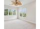 Bright bedroom with large windows and a ceiling fan at 5250 Timber Race Crse, Hollywood, SC 29449