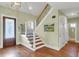 Hardwood floors, staircase, and glass doors in an entryway at 2873 Maritime Forest Dr, Johns Island, SC 29455