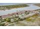 Aerial view of waterfront community with pool and boat docks at 93 Mariners Cay Drive, Folly Beach, SC 29439