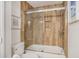 Updated bathroom with a glass shower door and wood-look tile at 93 Mariners Cay Drive, Folly Beach, SC 29439