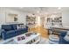 Open concept living and kitchen area with hardwood floors at 93 Mariners Cay Drive, Folly Beach, SC 29439