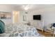 Bedroom with king-size bed, dresser, and rocking chair at 93 Mariners Cay Drive, Folly Beach, SC 29439