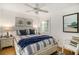 Bedroom with a queen bed and coastal decor at 93 Mariners Cay Drive, Folly Beach, SC 29439