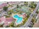 Community pool with surrounding patio and tennis courts at 93 Mariners Cay Drive, Folly Beach, SC 29439