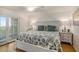 Main bedroom with a king-size bed and private balcony access at 93 Mariners Cay Drive, Folly Beach, SC 29439