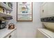 Convenient laundry area with washer, dryer, and extra shelving at 93 Mariners Cay Drive, Folly Beach, SC 29439