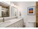 Bathroom boasts double sinks, quartz countertops, and modern fixtures at 93 Mariners Cay Drive, Folly Beach, SC 29439