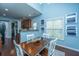 Dining area with hardwood floors and light blue walls at 3807 Canary Ct, North Charleston, SC 29420