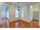 Bright dining room with hardwood floors and access to kitchen and sunroom at 106 Aviary Ct, Summerville, SC 29483