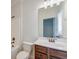 Clean bathroom with dark vanity, white countertop, and large mirror at 106 Aviary Ct, Summerville, SC 29483