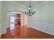Elegant dining room features hardwood floors and a chandelier at 106 Aviary Ct, Summerville, SC 29483