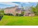Brick house with attached garage, covered patio, and landscaped yard at 106 Aviary Ct, Summerville, SC 29483