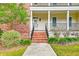 Front entrance with brick stairs and landscaping at 106 Aviary Ct, Summerville, SC 29483
