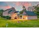 Brick house with attached garage, covered patio, and landscaped yard at 106 Aviary Ct, Summerville, SC 29483