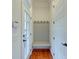 Bright entryway with built-in bench, hooks, and hardwood floors at 106 Aviary Ct, Summerville, SC 29483