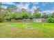 Large backyard with firepit and wooden fence at 106 Aviary Ct, Summerville, SC 29483