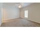 Bright bedroom with ceiling fan and neutral colored carpet at 106 Aviary Ct, Summerville, SC 29483