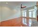 Bright living room with hardwood floors, french doors, and a fireplace at 106 Aviary Ct, Summerville, SC 29483