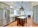 Modern kitchen with granite countertops, stainless steel appliances, and hardwood floors at 106 Aviary Ct, Summerville, SC 29483