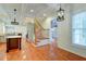 Open concept kitchen with island, gray cabinets, and hardwood floors at 106 Aviary Ct, Summerville, SC 29483
