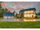 Two-story brick home with a three-car garage and circular driveway at 106 Aviary Ct, Summerville, SC 29483
