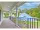 Enjoy views from this covered balcony with wood decking and iron railing at 106 Aviary Ct, Summerville, SC 29483
