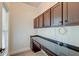 Home office with dark wood cabinets and desk at 106 Aviary Ct, Summerville, SC 29483