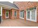 Spacious deck with brick exterior and access to the backyard at 106 Aviary Ct, Summerville, SC 29483