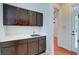 Well-equipped laundry room with cabinetry and sink at 106 Aviary Ct, Summerville, SC 29483