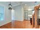 Hardwood floor dining room, view of kitchen, and staircase at 106 Aviary Ct, Summerville, SC 29483