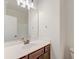 Modern bathroom vanity with white countertop and dark brown cabinets at 106 Aviary Ct, Summerville, SC 29483