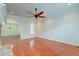 Spacious living room featuring hardwood floors, a ceiling fan, and views into adjacent dining area at 106 Aviary Ct, Summerville, SC 29483