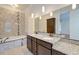 Double vanity bathroom with granite countertop and soaking tub at 106 Aviary Ct, Summerville, SC 29483