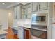 Modern kitchen with gray cabinets, granite countertops and built-in appliances at 106 Aviary Ct, Summerville, SC 29483