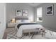 Main bedroom with stylish decor and bench at foot of bed at 171 Rosefield Ct, Summerville, SC 29485