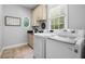 Laundry room with washer, dryer, and built-in cabinets at 147 Madison Brooke Ln, Summerville, SC 29486