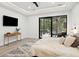 Spacious bedroom with sliding doors to backyard, a king bed, and a wood dresser at 4028 Gnarled Oaks Ln, Johns Island, SC 29455