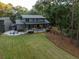 Elevated view of a backyard oasis with a large deck, pool, and patio area at 4028 Gnarled Oaks Ln, Johns Island, SC 29455