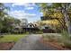 House exterior showcasing landscaping and driveway at 4028 Gnarled Oaks Ln, Johns Island, SC 29455