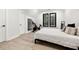 Bedroom with a queen bed, exercise bike and plenty of natural light at 4028 Gnarled Oaks Ln, Johns Island, SC 29455
